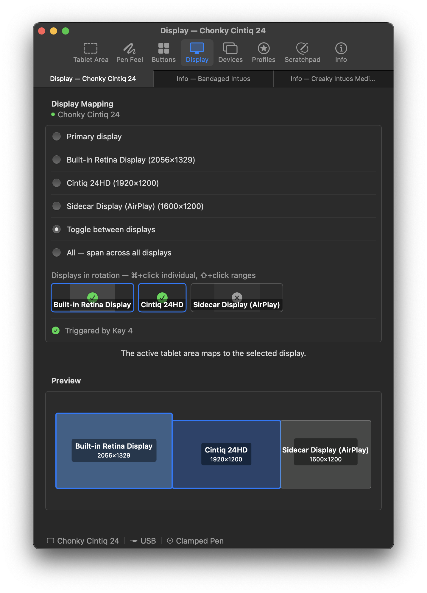 Display mapping panel routing the tablet to a chosen monitor (dark theme)